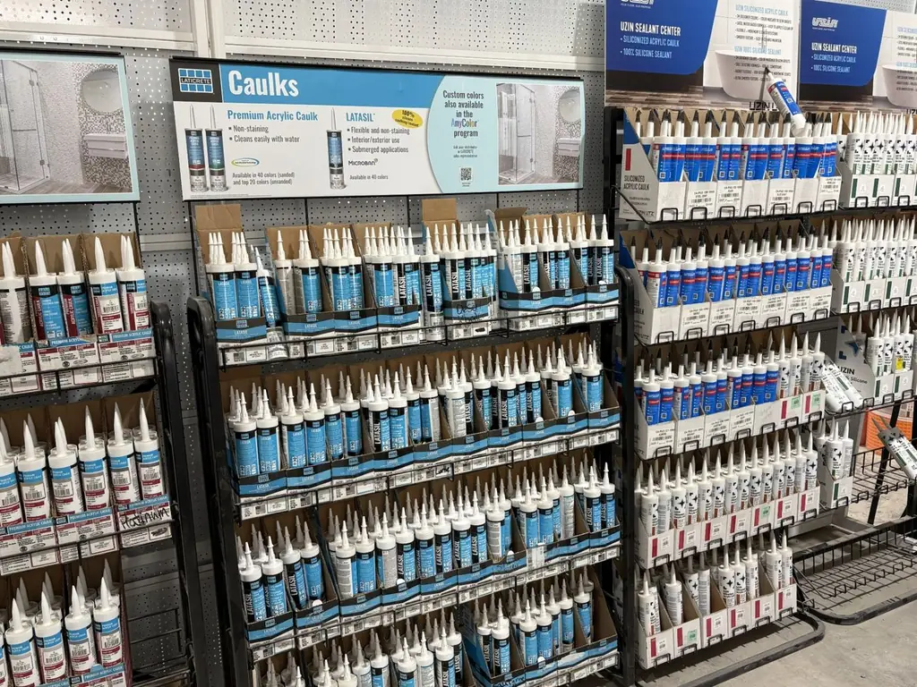 Laticrete Latasil and premium acrylic caulk rack beside the Uzin sealant center at Sundry Pro Shop