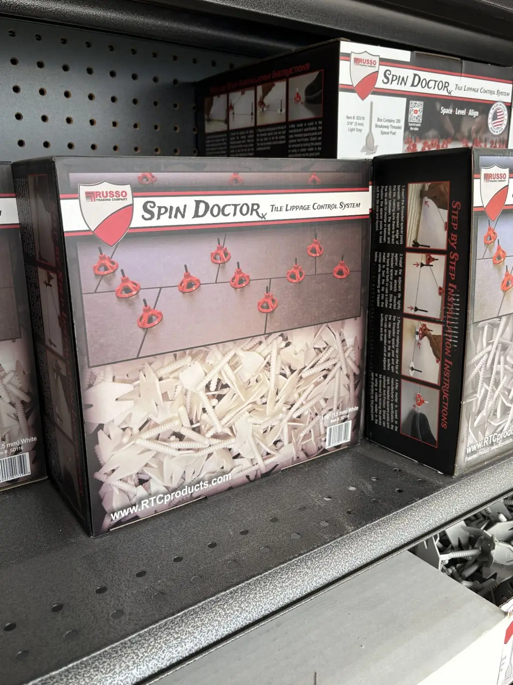 Boxes of Russo Trading Company Spin Doctor tile lippage control system at Sundry Pro Shop